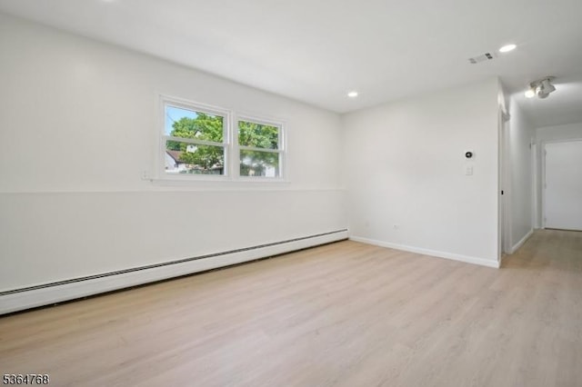 500 Sioux Ave, Parsippany-Troy Hills Twp, NJ 07034 - unfurnished room featuring a baseboard heating unit, light wood-type flooring, and recessed lighting