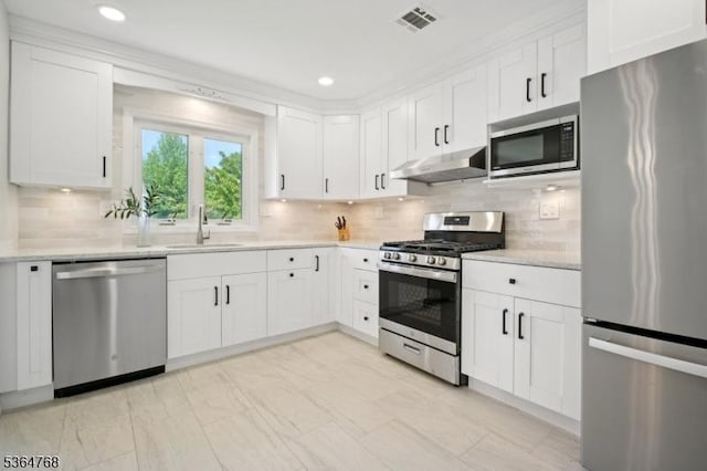 500 Sioux Ave, Parsippany-Troy Hills Twp, NJ 07034 - kitchen with stainless steel appliances, under cabinet range hood, light countertops, white cabinetry, and recessed lighting