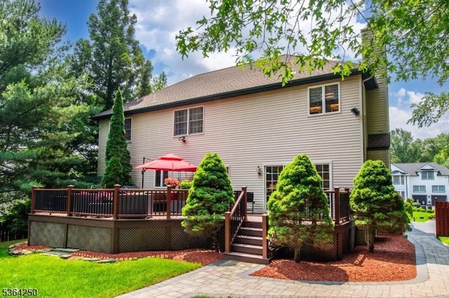 6 Anna Rose Ct, Bloomingdale Boro, NJ 07403 - rear view of property with a chimney and a wooden deck