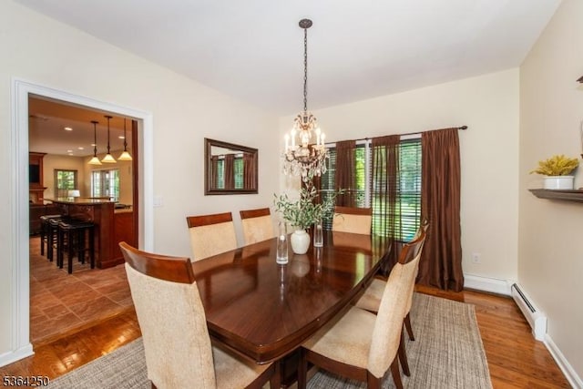 6 Anna Rose Ct, Bloomingdale Boro, NJ 07403 - dining area featuring a chandelier, wood finished floors, and baseboard heating