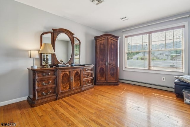 458 Midland Ave, Pompton Lakes Boro, NJ 07442 - bedroom featuring a baseboard heating unit and light wood-style flooring