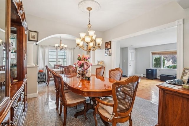 458 Midland Ave, Pompton Lakes Boro, NJ 07442 - dining space featuring a chandelier, arched walkways, and baseboard heating