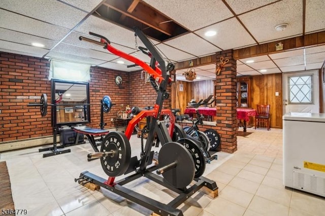 458 Midland Ave, Pompton Lakes Boro, NJ 07442 - exercise room with a paneled ceiling, brick wall, tile patterned flooring, and recessed lighting