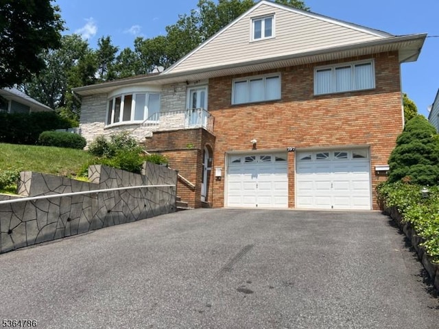 797 Chestnut St, Union Twp, NJ 07083 - view of front facade with brick siding, an attached garage, and asphalt driveway