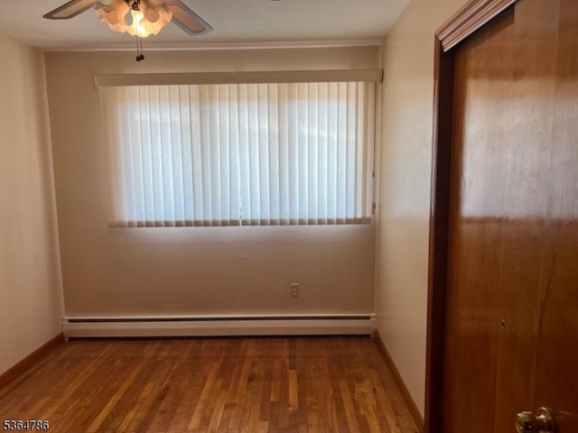 797 Chestnut St, Union Twp, NJ 07083 - spare room featuring a ceiling fan, a baseboard radiator, and wood finished floors