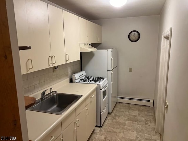 797 Chestnut St, Union Twp, NJ 07083 - kitchen with baseboard heating, white gas range, ventilation hood, backsplash, and white cabinets
