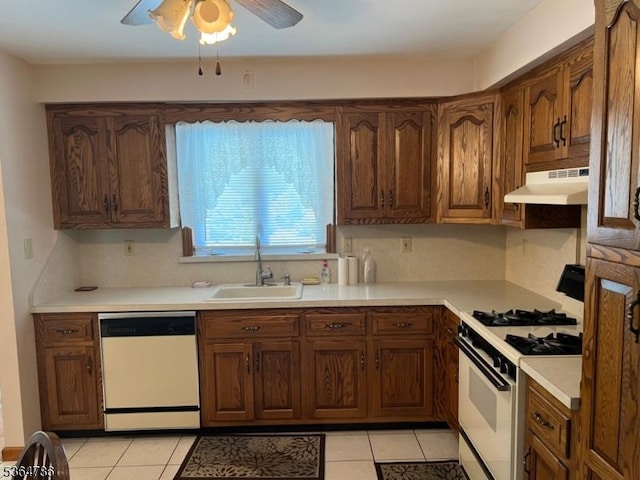 797 Chestnut St, Union Twp, NJ 07083 - kitchen with white appliances, under cabinet range hood, a ceiling fan, and light tile patterned floors