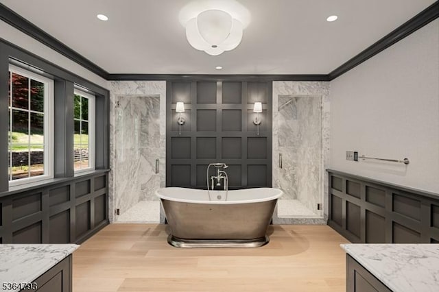 171 Campbell Rd, Bernardsville Boro, NJ 07924 - bathroom featuring ornamental molding, a decorative wall, a marble finish shower, wood finished floors, and a soaking tub