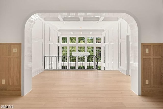 171 Campbell Rd, Bernardsville Boro, NJ 07924 - corridor featuring light wood finished floors, arched walkways, and coffered ceiling