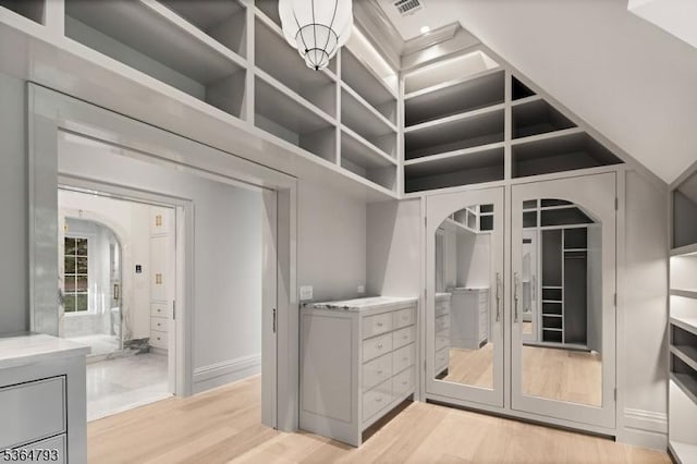 171 Campbell Rd, Bernardsville Boro, NJ 07924 - spacious closet featuring light wood-style floors and arched walkways