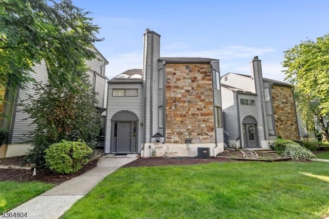 27 Delbarton Ct, Washington Twp, NJ 07840 - multi unit property featuring stone siding, a front yard, and a chimney