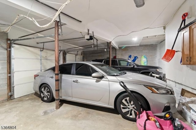 27 Delbarton Ct, Washington Twp, NJ 07840 - garage with concrete block wall and a garage door opener