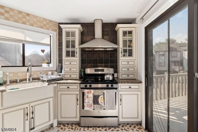 27 Delbarton Ct, Washington Twp, NJ 07840 - kitchen featuring stainless steel gas range oven, wall chimney exhaust hood, healthy amount of natural light, and cream cabinetry