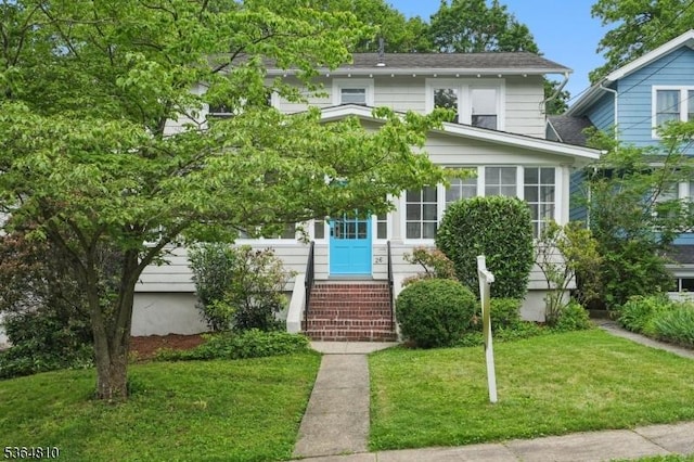 26 Saint Lawrence Ave, Maplewood Twp, NJ 07040 - traditional style home featuring a front lawn and a sunroom