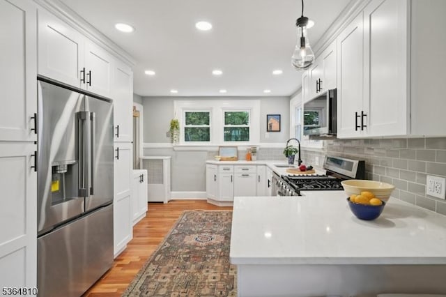 26 Saint Lawrence Ave, Maplewood Twp, NJ 07040 - kitchen with appliances with stainless steel finishes, light wood-type flooring, tasteful backsplash, and recessed lighting