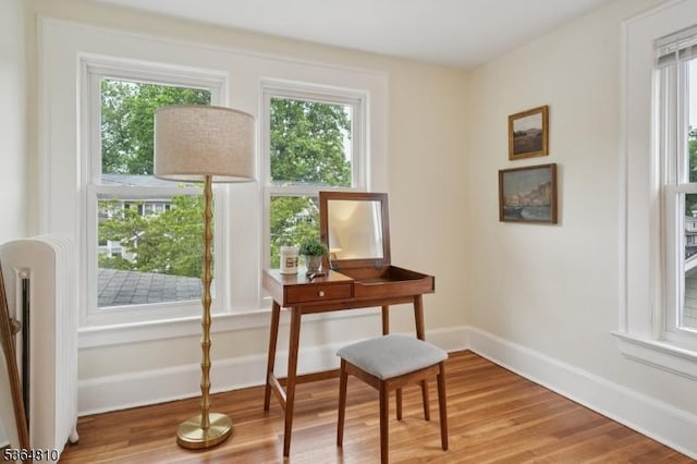 26 Saint Lawrence Ave, Maplewood Twp, NJ 07040 - sitting room with plenty of natural light and light wood-style floors