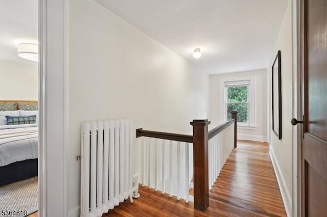 26 Saint Lawrence Ave, Maplewood Twp, NJ 07040 - hallway with radiator, wood finished floors, and an upstairs landing