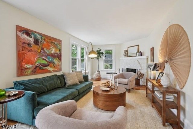 26 Saint Lawrence Ave, Maplewood Twp, NJ 07040 - living room with a brick fireplace and wood finished floors