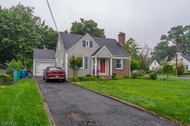 510 Oakridge Ave, North Plainfield Boro, NJ 07063 - view of front facade featuring asphalt driveway, a chimney, a front lawn, a shingled roof, and a garage