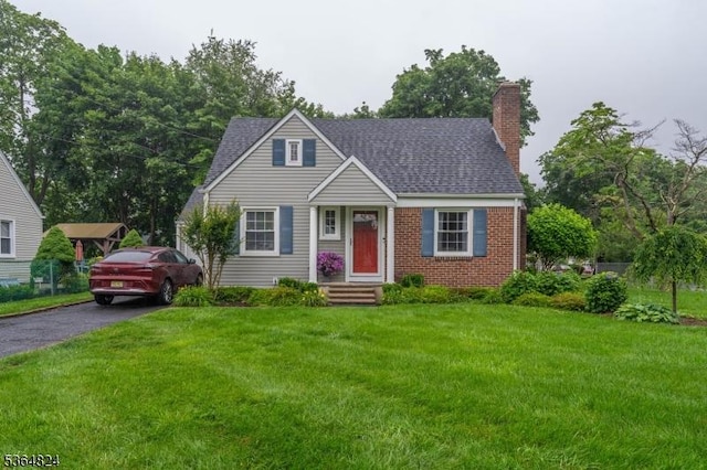 510 Oakridge Ave, North Plainfield Boro, NJ 07063 - view of front of house with a chimney, a front lawn, roof with shingles, and brick siding