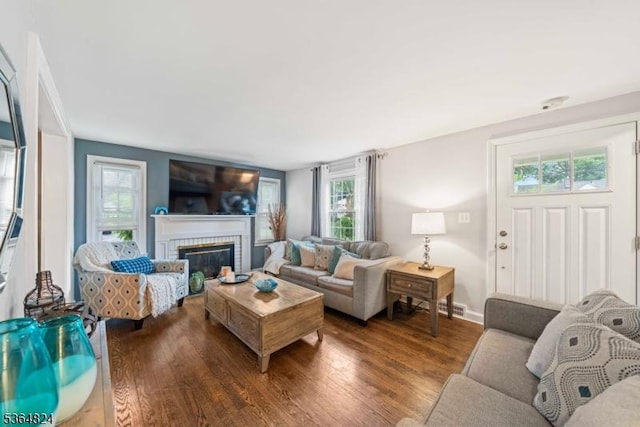 510 Oakridge Ave, North Plainfield Boro, NJ 07063 - living area with wood finished floors, a brick fireplace, and plenty of natural light