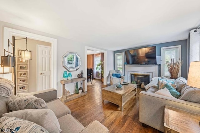 510 Oakridge Ave, North Plainfield Boro, NJ 07063 - living room featuring plenty of natural light, wood finished floors, and a brick fireplace