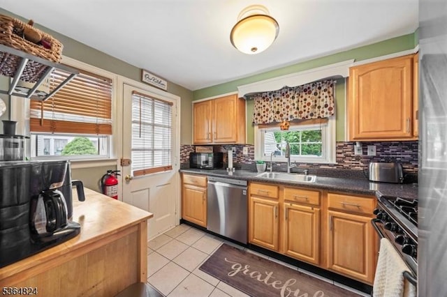 510 Oakridge Ave, North Plainfield Boro, NJ 07063 - kitchen with stainless steel appliances, healthy amount of natural light, light tile patterned floors, and tasteful backsplash
