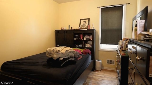 1371 Clinton Ave, Irvington Twp, NJ 07111 - bedroom featuring wood finished floors and baseboards