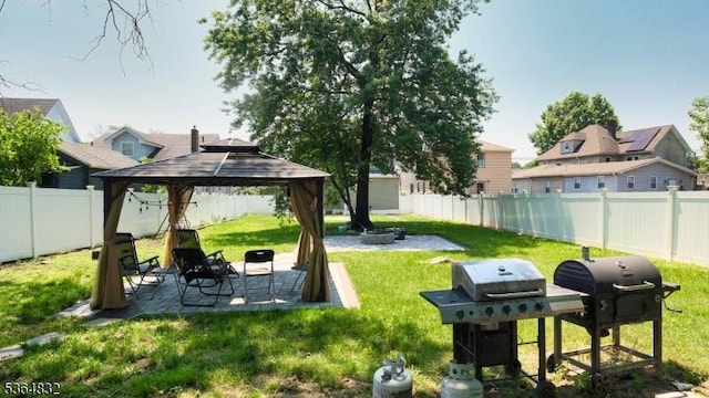 1371 Clinton Ave, Irvington Twp, NJ 07111 - fenced backyard with a fire pit, a gazebo, and a patio area