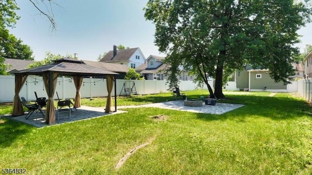 1371 Clinton Ave, Irvington Twp, NJ 07111 - fenced backyard with a patio, a gazebo, and an outdoor fire pit