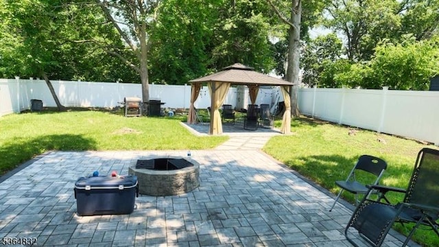 1371 Clinton Ave, Irvington Twp, NJ 07111 - fenced backyard featuring a gazebo, a fire pit, and a patio area