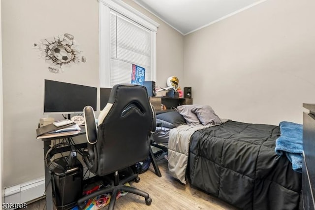 29 Pitt St, Bloomfield Twp, NJ 07003 - bedroom with ornamental molding, light wood-style flooring, baseboard heating, and a desk