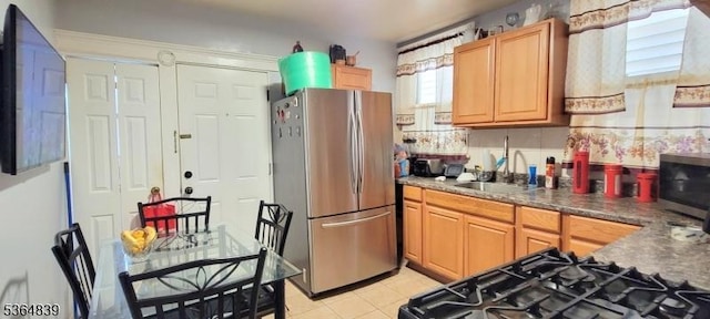 209 Sylvan Ave, Newark City, NJ 07104 - kitchen with stainless steel appliances, light tile patterned floors, and dark countertops