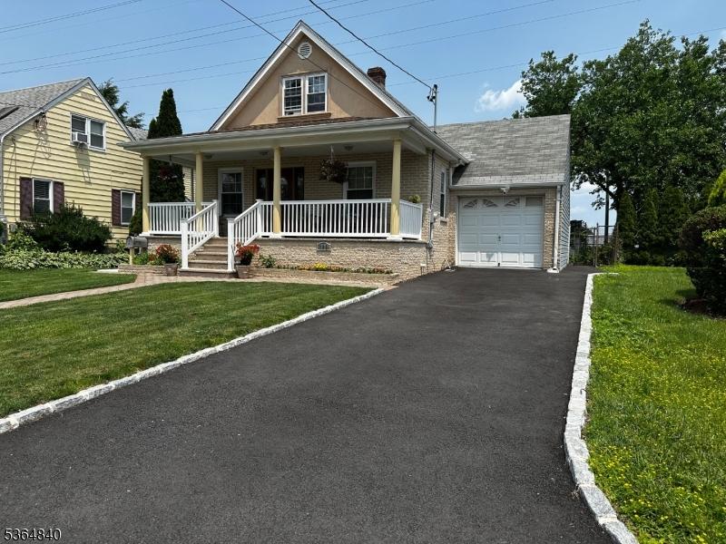 192 Beech St, Belleville Twp, NJ 07109 - view of front of house with asphalt driveway, an attached garage, a front yard, covered porch, and brick siding