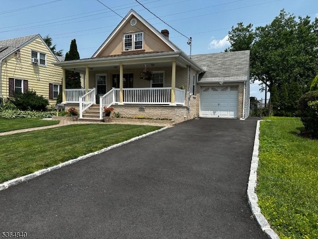 192 Beech St, Belleville Twp, NJ 07109 - view of front of house with asphalt driveway, an attached garage, a front yard, covered porch, and brick siding