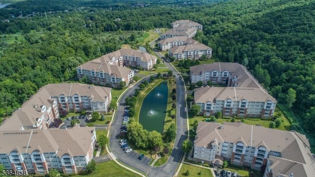 1409 Warrens Way Unit 1409, Wanaque Boro, NJ 07465 - aerial view of property and surrounding area with a heavily wooded area and a nearby body of water