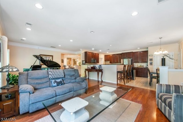 1409 Warrens Way Unit 1409, Wanaque Boro, NJ 07465 - living room featuring a chandelier, wood finished floors, crown molding, and recessed lighting