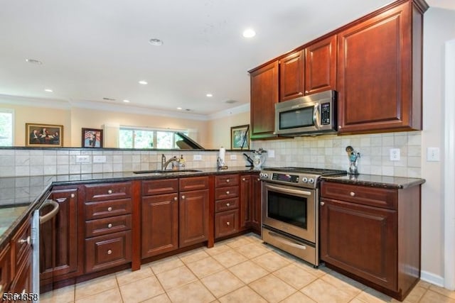 1409 Warrens Way Unit 1409, Wanaque Boro, NJ 07465 - kitchen featuring stainless steel appliances, plenty of natural light, dark stone countertops, ornamental molding, and recessed lighting