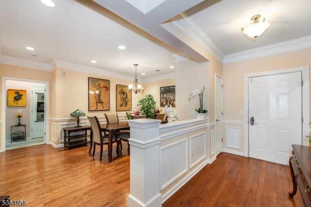 1409 Warrens Way Unit 1409, Wanaque Boro, NJ 07465 - foyer featuring a decorative wall, wood finished floors, crown molding, recessed lighting, and a wainscoted wall