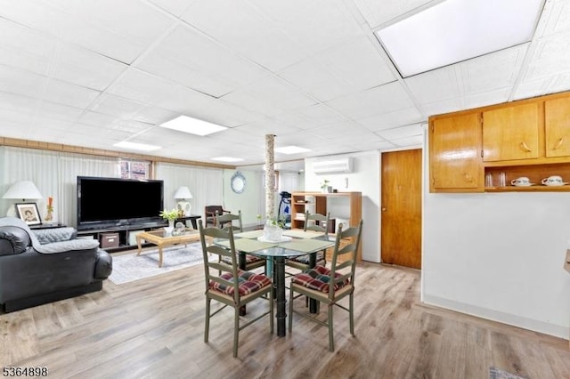 1221 Kelly St, Union Twp, NJ 07083 - dining room with light wood-style floors and a wall unit AC