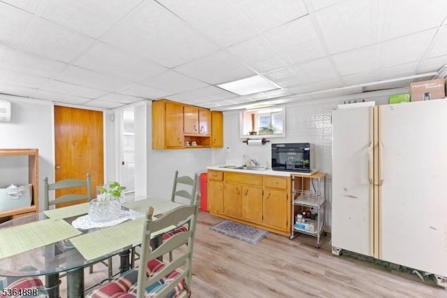 1221 Kelly St, Union Twp, NJ 07083 - kitchen featuring freestanding refrigerator, light wood-style floors, and light countertops