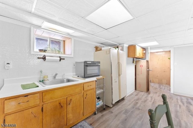 1221 Kelly St, Union Twp, NJ 07083 - kitchen with light wood-style flooring, light countertops, and freestanding refrigerator