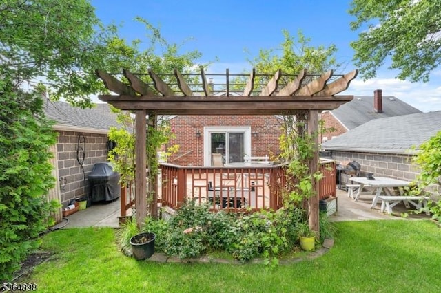 1221 Kelly St, Union Twp, NJ 07083 - back of property featuring brick siding, a yard, a deck, a patio area, and a pergola