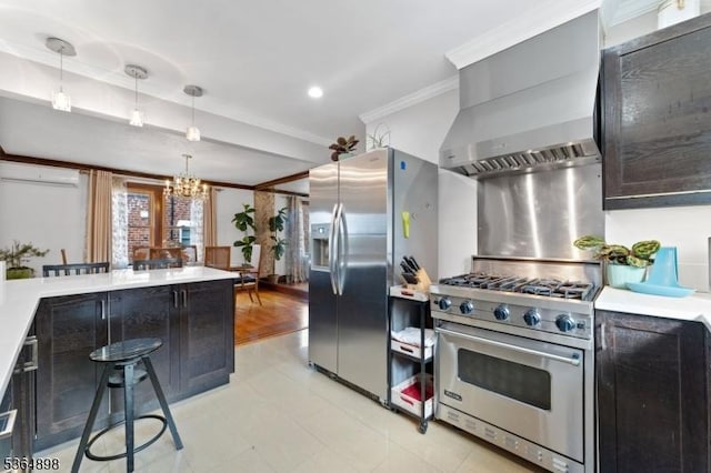 1221 Kelly St, Union Twp, NJ 07083 - kitchen with stainless steel appliances, a chandelier, crown molding, wall chimney exhaust hood, and light countertops