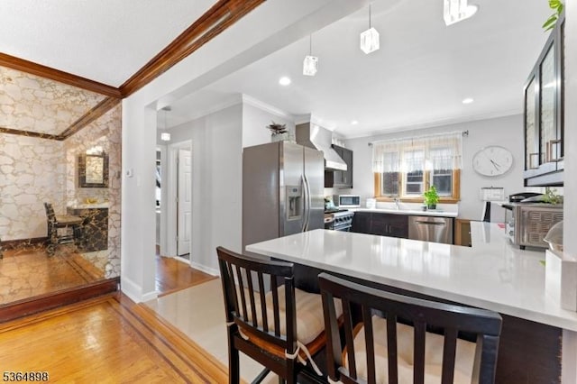 1221 Kelly St, Union Twp, NJ 07083 - kitchen featuring stainless steel appliances, crown molding, a peninsula, light countertops, and light wood-style floors