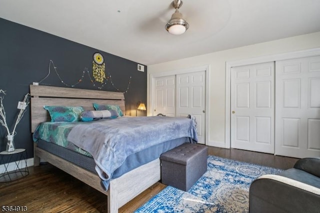 286 Meadow Rd Unit Rt17, Serv Rutherford Boro, NJ 07070 - bedroom featuring multiple closets, wood finished floors, and a ceiling fan