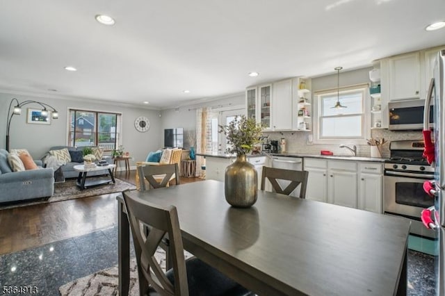 286 Meadow Rd Unit Rt17, Serv Rutherford Boro, NJ 07070 - dining room with healthy amount of natural light, recessed lighting, and crown molding