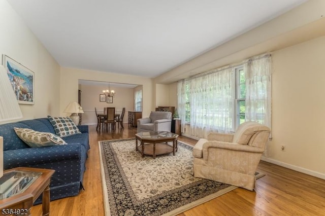 263 Bellemead Griggstown Rd, Montgomery Twp, NJ 08502 - living room featuring a chandelier and wood finished floors
