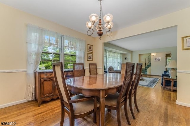 263 Bellemead Griggstown Rd, Montgomery Twp, NJ 08502 - dining room featuring a chandelier, light wood finished floors, and stairway