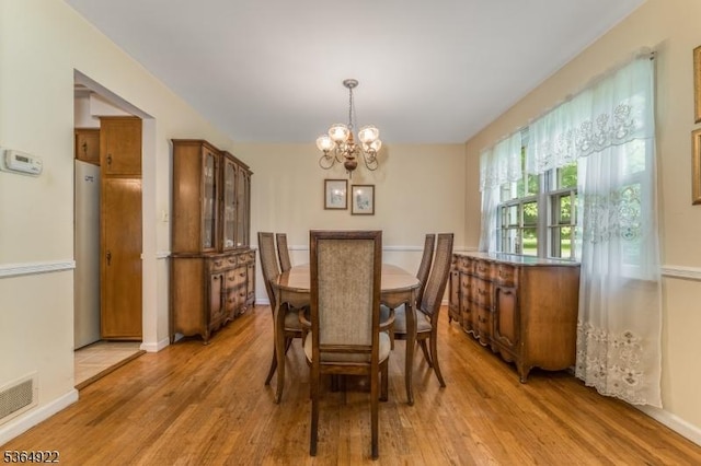 263 Bellemead Griggstown Rd, Montgomery Twp, NJ 08502 - dining room with a chandelier and light wood-style floors